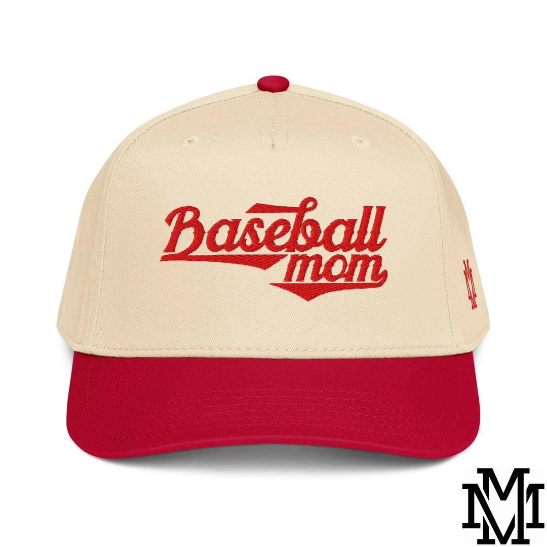 Cream-colored baseball cap with red brim and button embroidered with baseball mom in bold red script for moms.