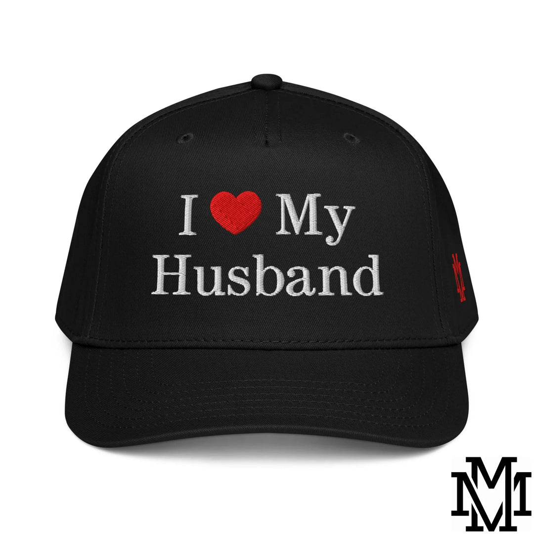 Black baseball cap with white embroidered i heart my husband text and red heart featuring small red side logo