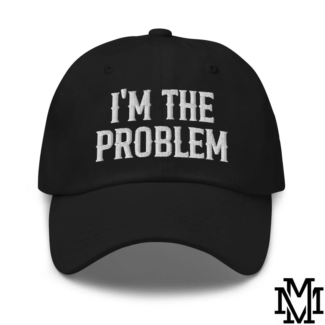 Black cotton baseball cap with white embroidered im the problem text in bold block font for casual fashion statement