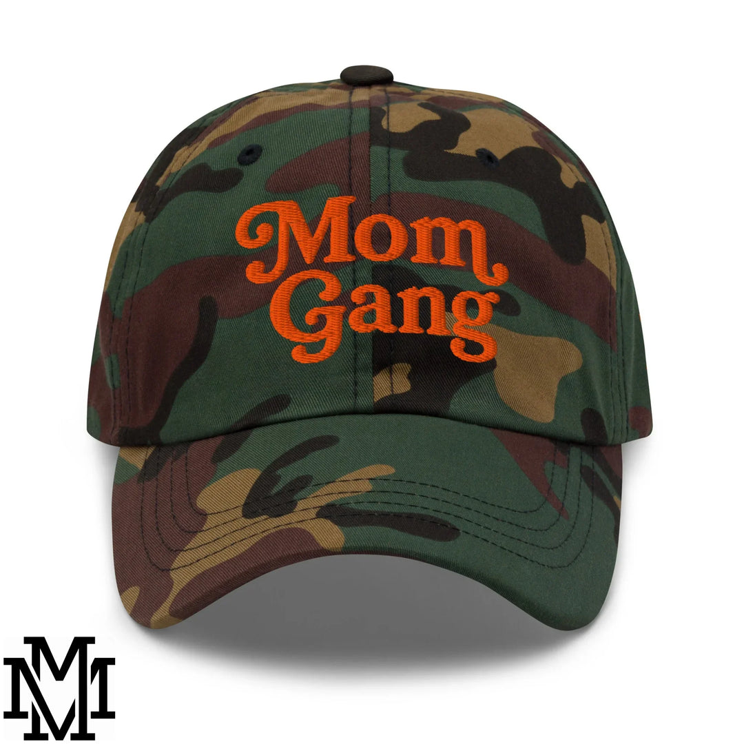 A camouflage baseball cap with bright orange mom gang embroidery featured in mimosa flavor ideas article.