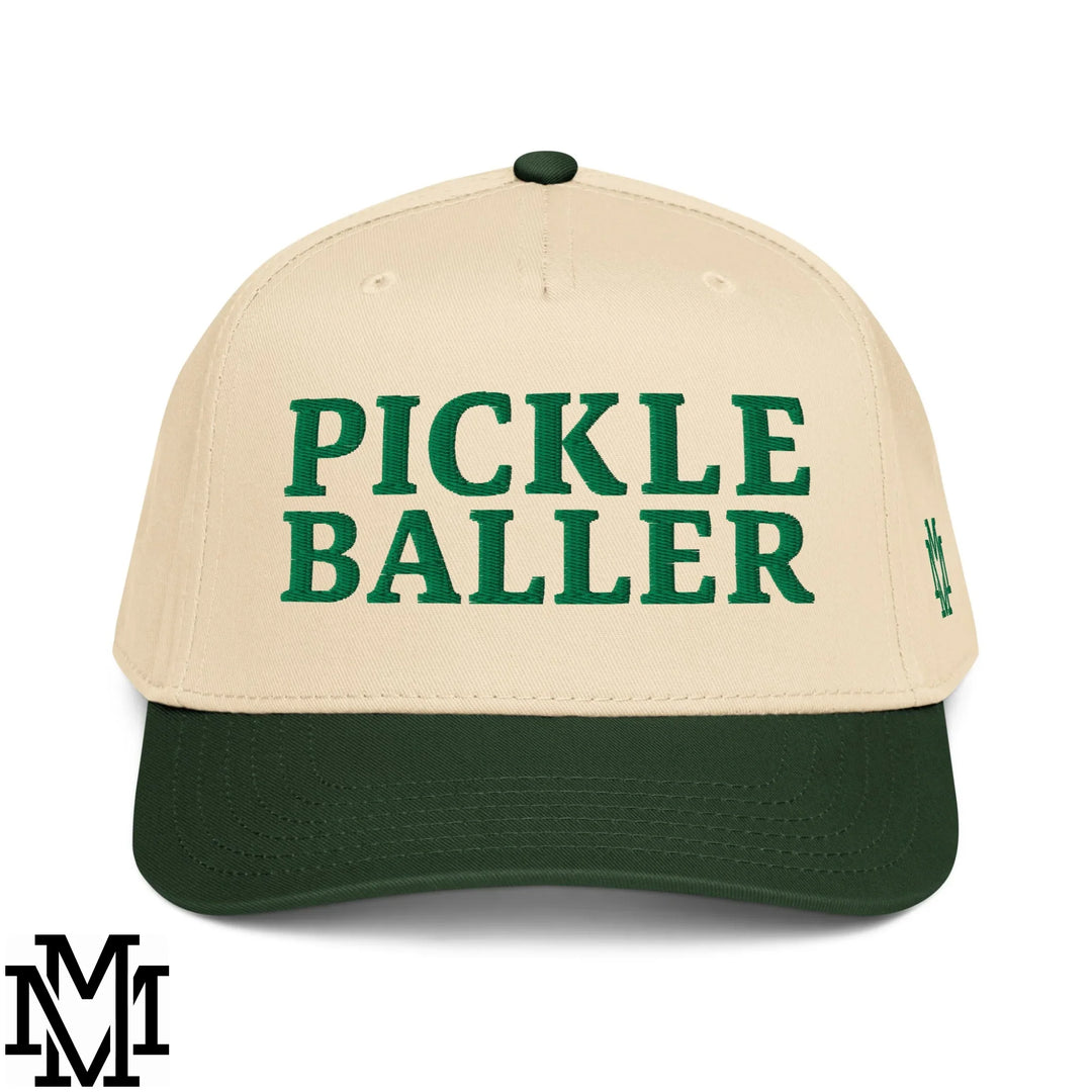 Beige and dark green baseball snapback hat with bold green pickle baller embroidery on front panel.