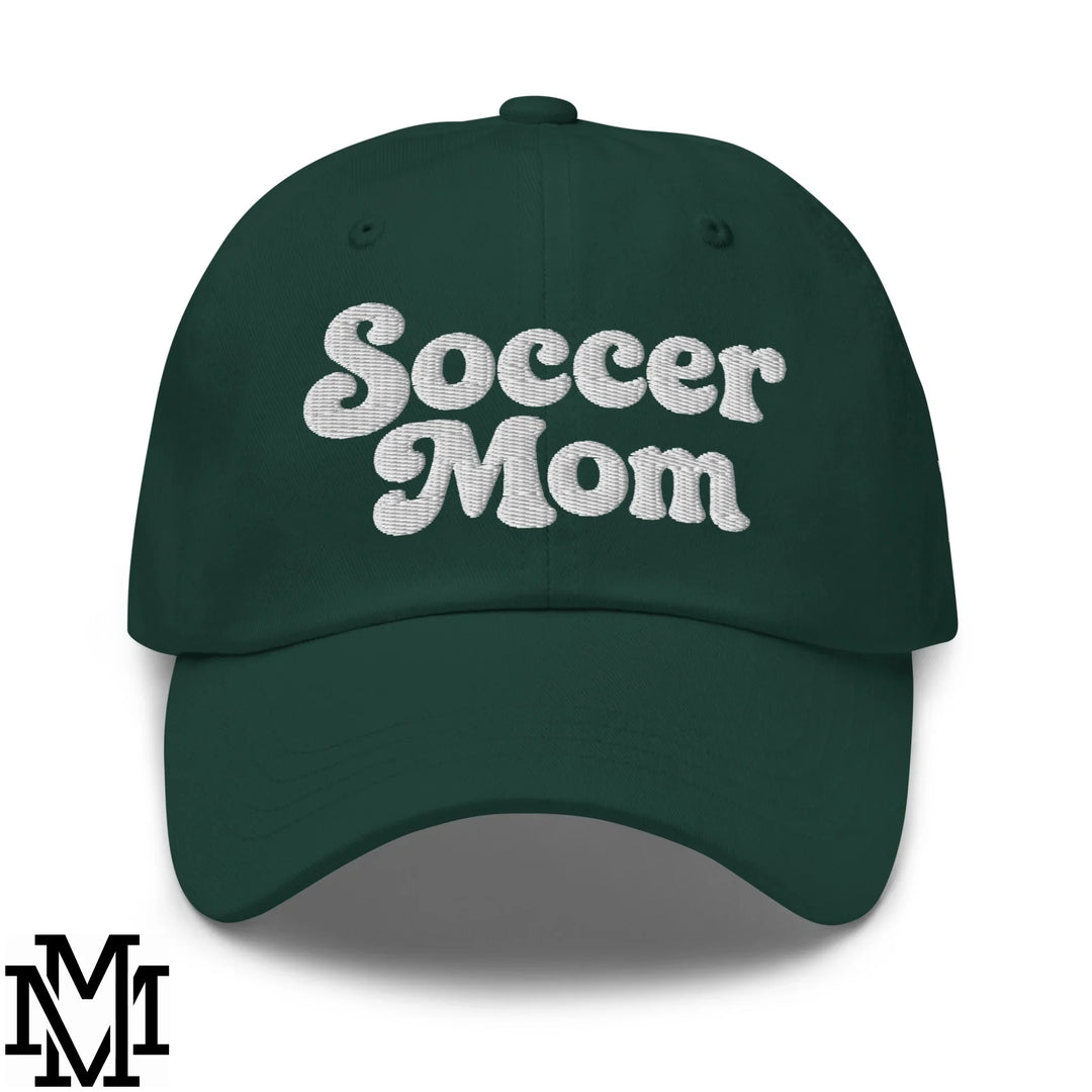 Dark green cotton baseball cap with soccer mom embroidered in white thread shown from the back in brunch tutorial article