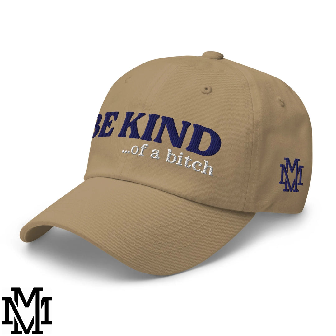 Beige embroidered unstructured dad hat with navy blue be kind of a bitch text and navy m logo on the side