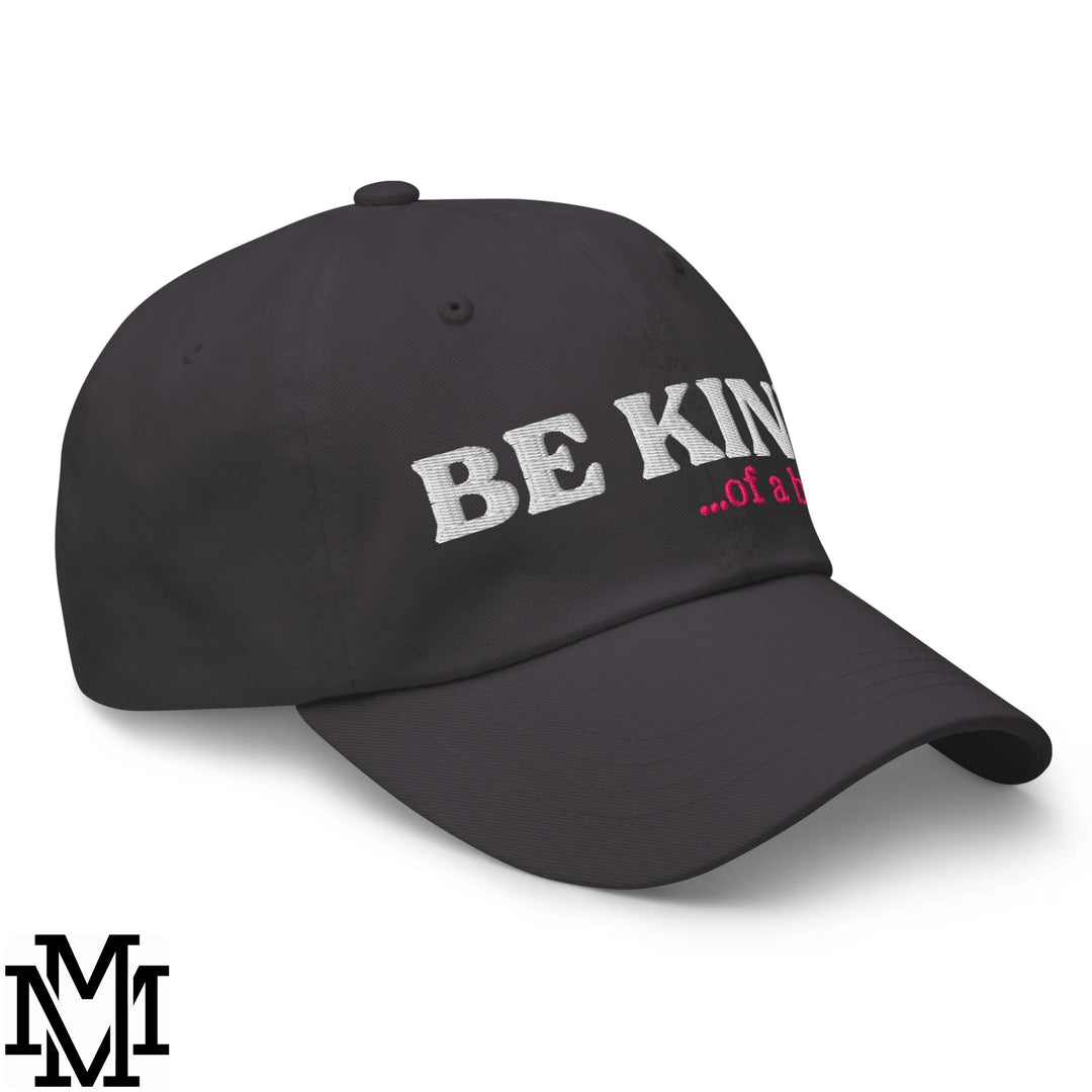Black unstructured dad hat with embroidered be kind in white and pink thread from be kind of a bitch collection