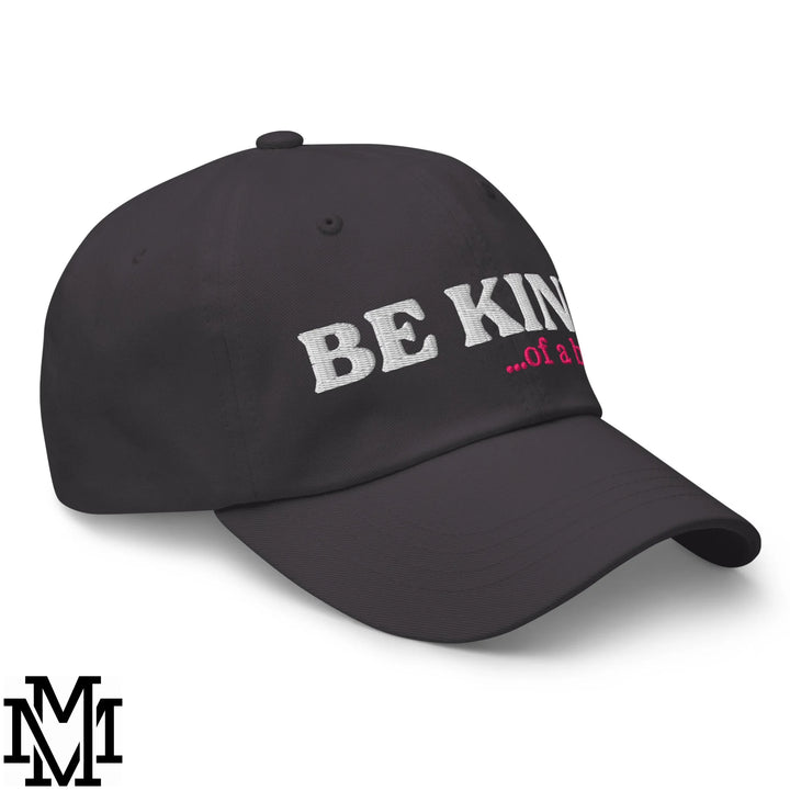 Black unstructured dad hat with embroidered be kind in white and pink thread from be kind of a bitch collection
