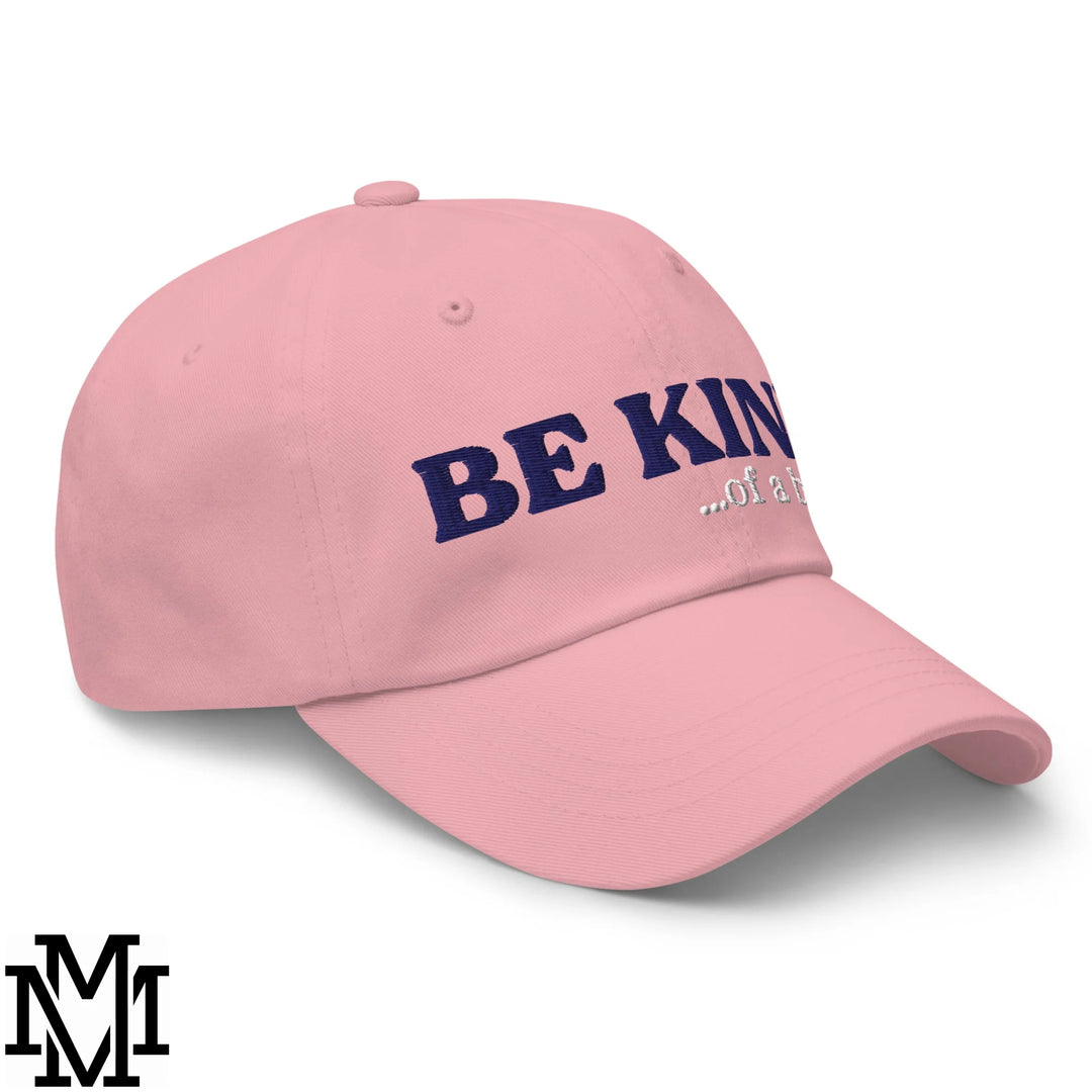 Pink unstructured dad hat with navy blue be kind of a embroidered text baseball cap for casual wear