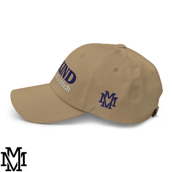 Beige unstructured dad hat with navy blue embroidered kind of a bitch text and matching am logo on the side