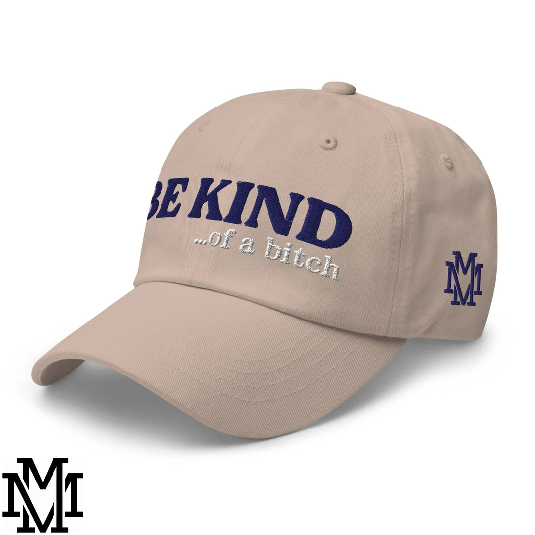 Be kind of a bitch embroidered unstructured dad hat beige with navy blue text and matching m logo on the side