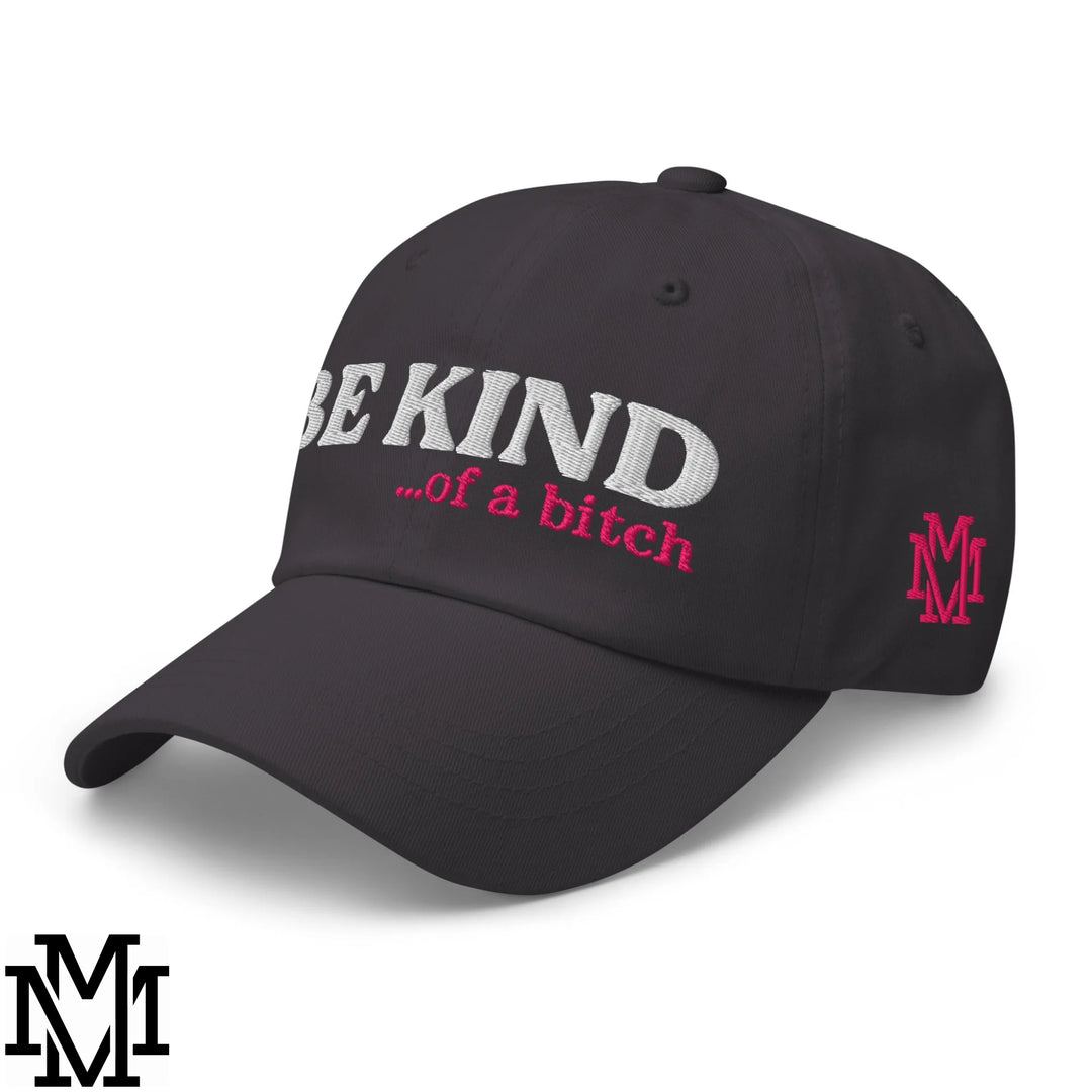 Black unstructured dad hat with embroidered white and pink be kind of a bitch text and pink m logo on the side
