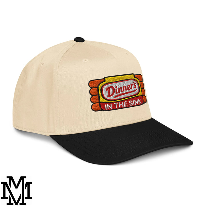 Beige and black dinner’s in the sink embroidered baseball snapback hat with red yellow and orange logo details