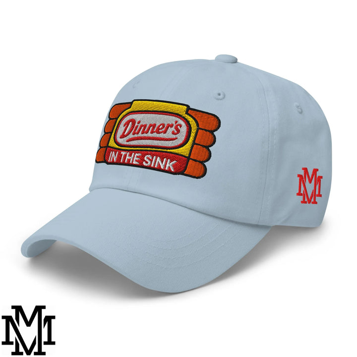 Light blue unstructured dad hat with embroidered dinner’s in the sink logo in yellow orange and red stitching