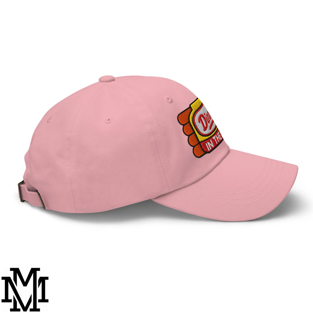 Pink cotton unstructured dad hat featuring a colorful embroidered dilly bar logo in the shape of a candy bar
