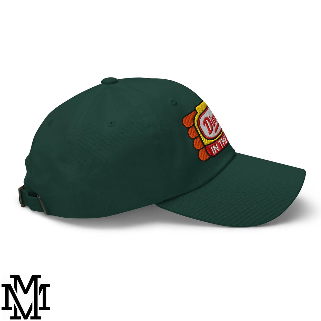Dark green unstructured dad hat with colorful embroidered diner in the text and orange scalloped patch design