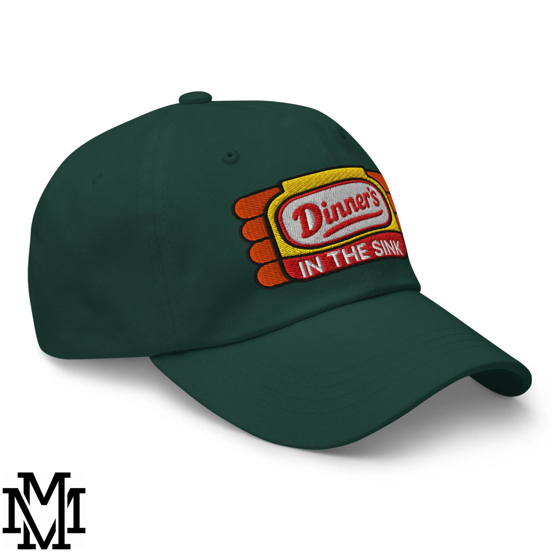 Dark green dinner’s in the sink embroidered unstructured dad hat with yellow patch and red white lettering