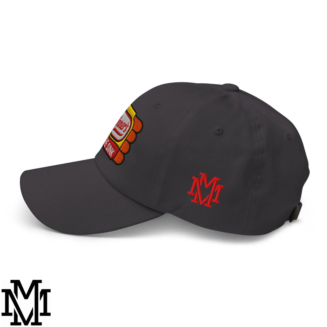 Dark gray unstructured dad hat featuring a colorful embroidered hot dog patch and a red m logo on the side