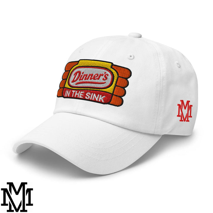 White unstructured dad hat with embroidered dinners in the sink logo in yellow orange and red thread