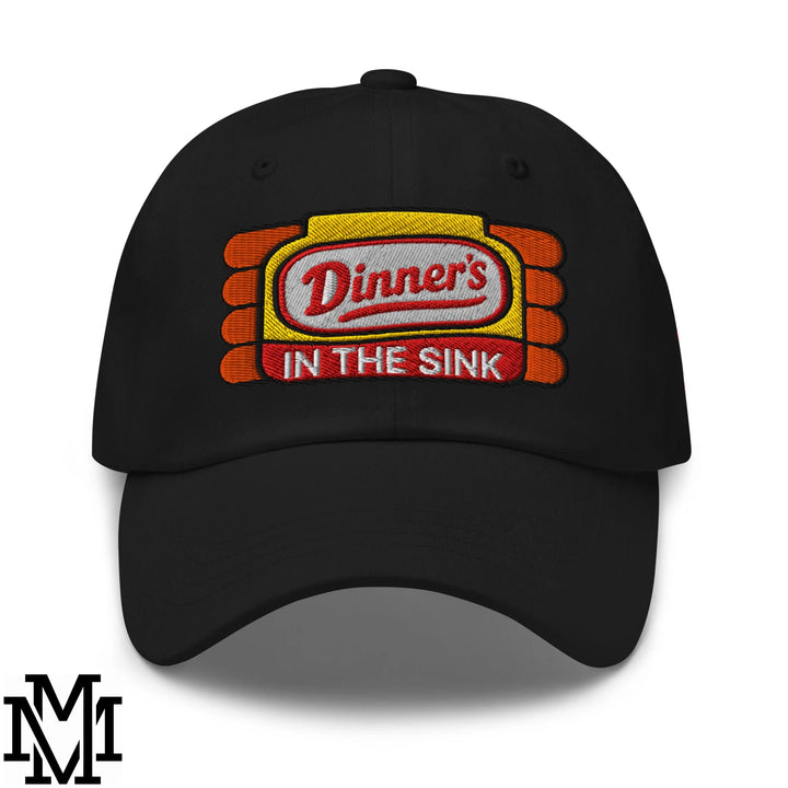 Black embroidered unstructured dad hat with yellow and orange ketchup bottle logo and red dinner’s in the sink text