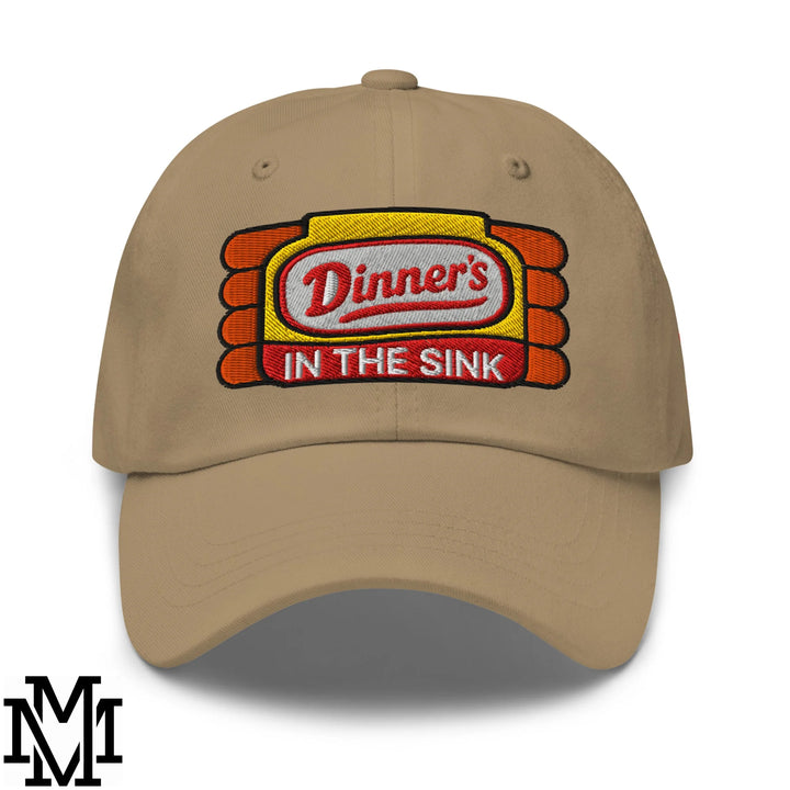 Beige unstructured dad hat featuring embroidered dinner’s in the sink red script logo on yellow and orange background