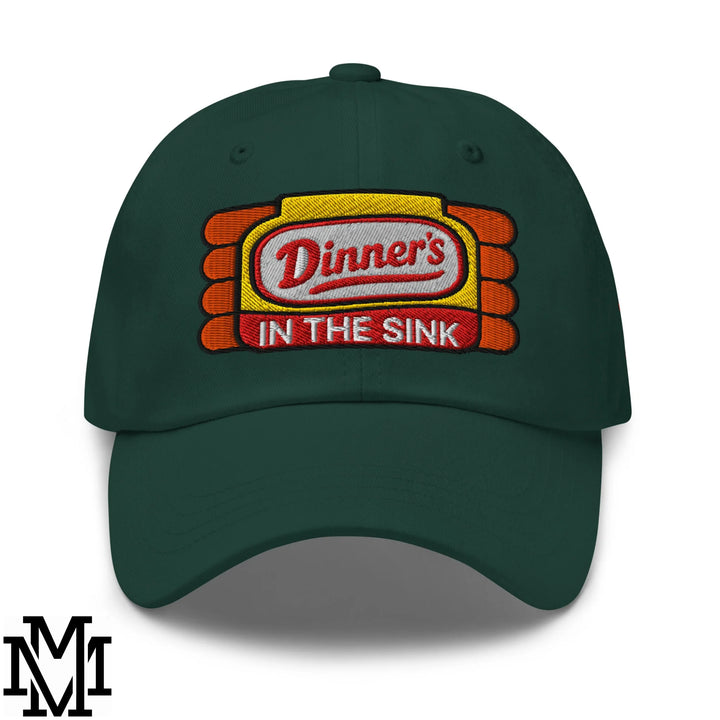 Dark green embroidered unstructured dad hat featuring a dinner’s in the sink patch with red white and yellow details