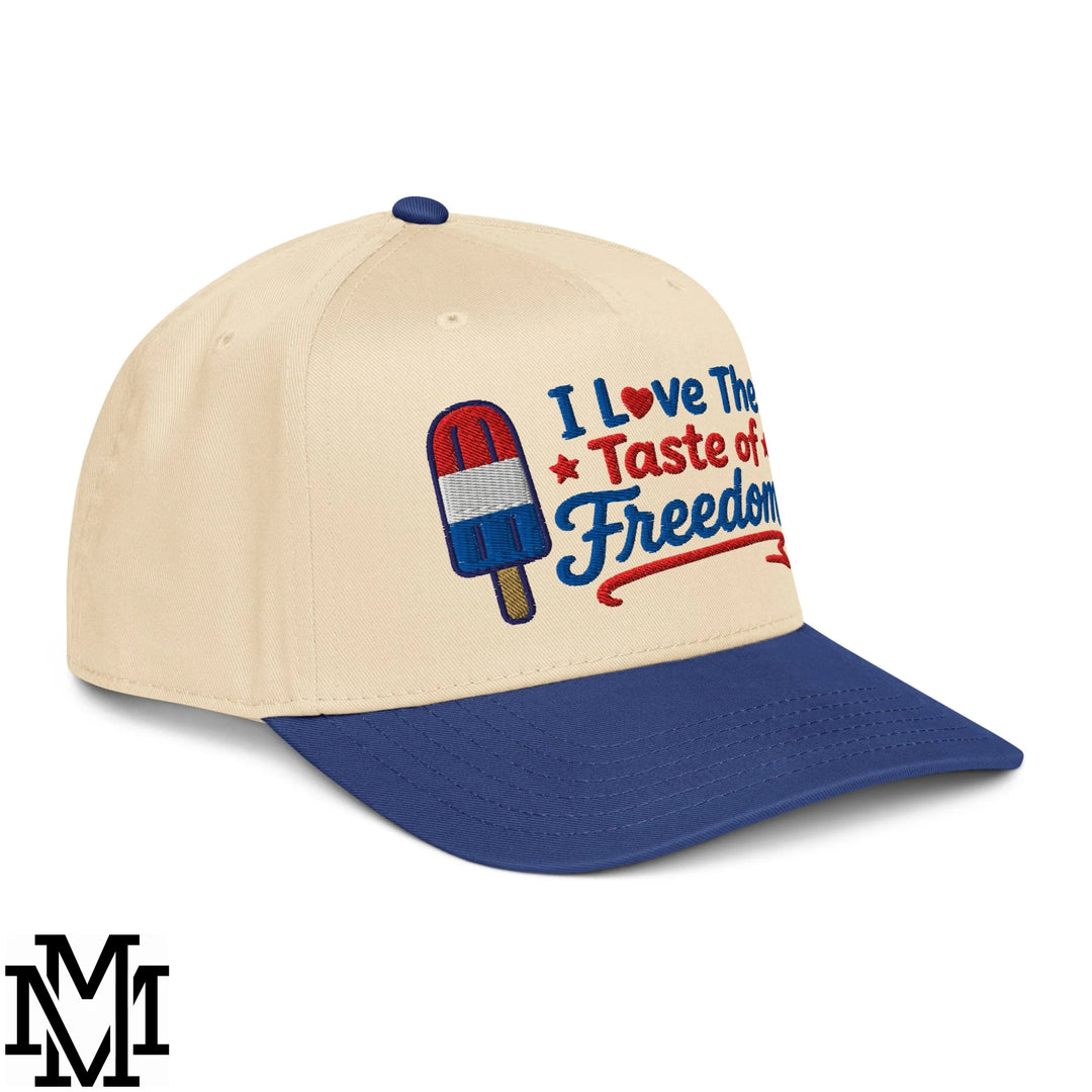Beige and navy blue baseball snapback hat with embroidered red white and blue popsicle and i love the taste of freedom text