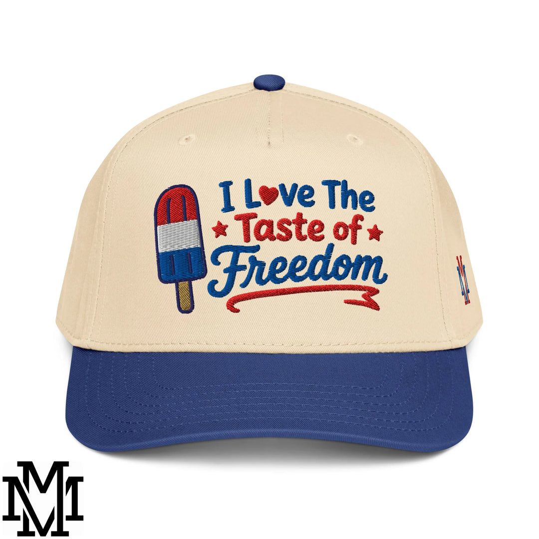 Beige and blue baseball snapback hat with embroidered red white and blue popsicle and I love the taste of freedom text