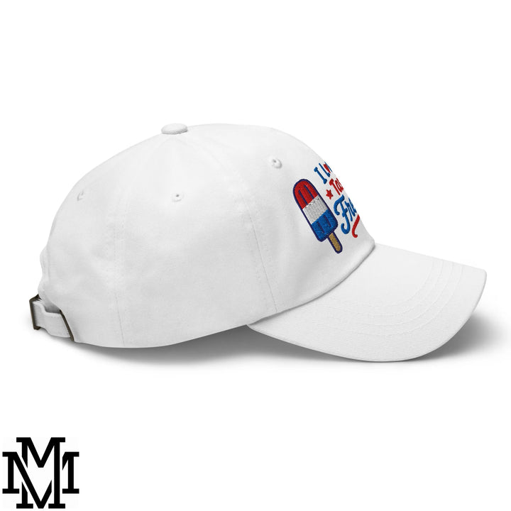 White unstructured dad hat with embroidered red white and blue popsicle and im a fire text for 4th of july freedom
