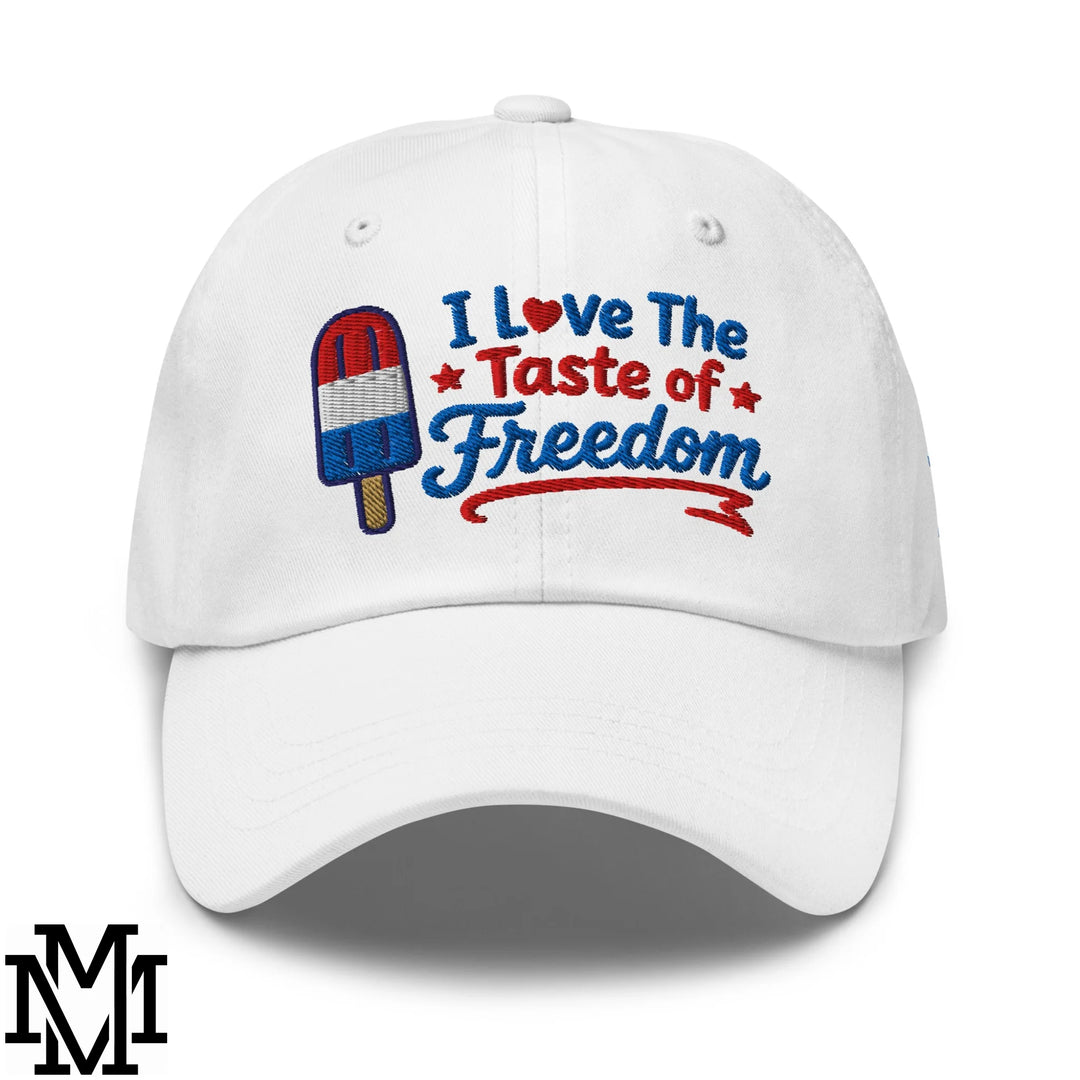 White unstructured dad hat with embroidered i love the taste of freedom text and patriotic popsicle design