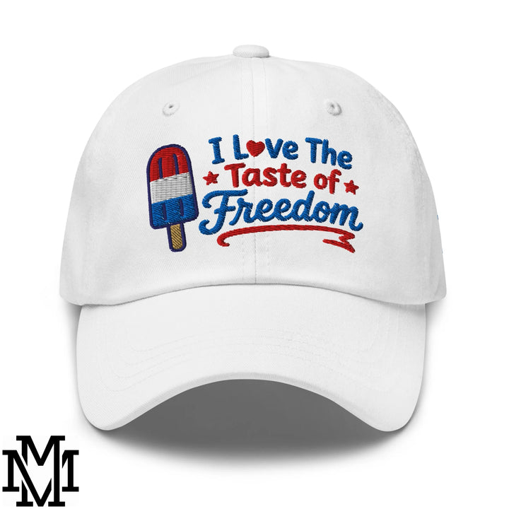 White unstructured dad hat with embroidered i love the taste of freedom text and patriotic popsicle design