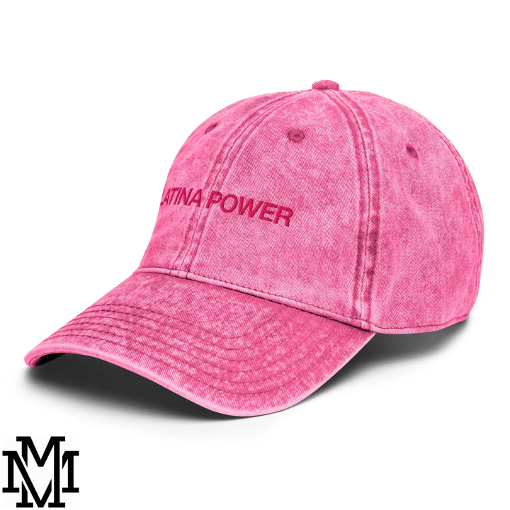 A faded pink denim dad hat with latina power embroidered in matching pink thread on the front