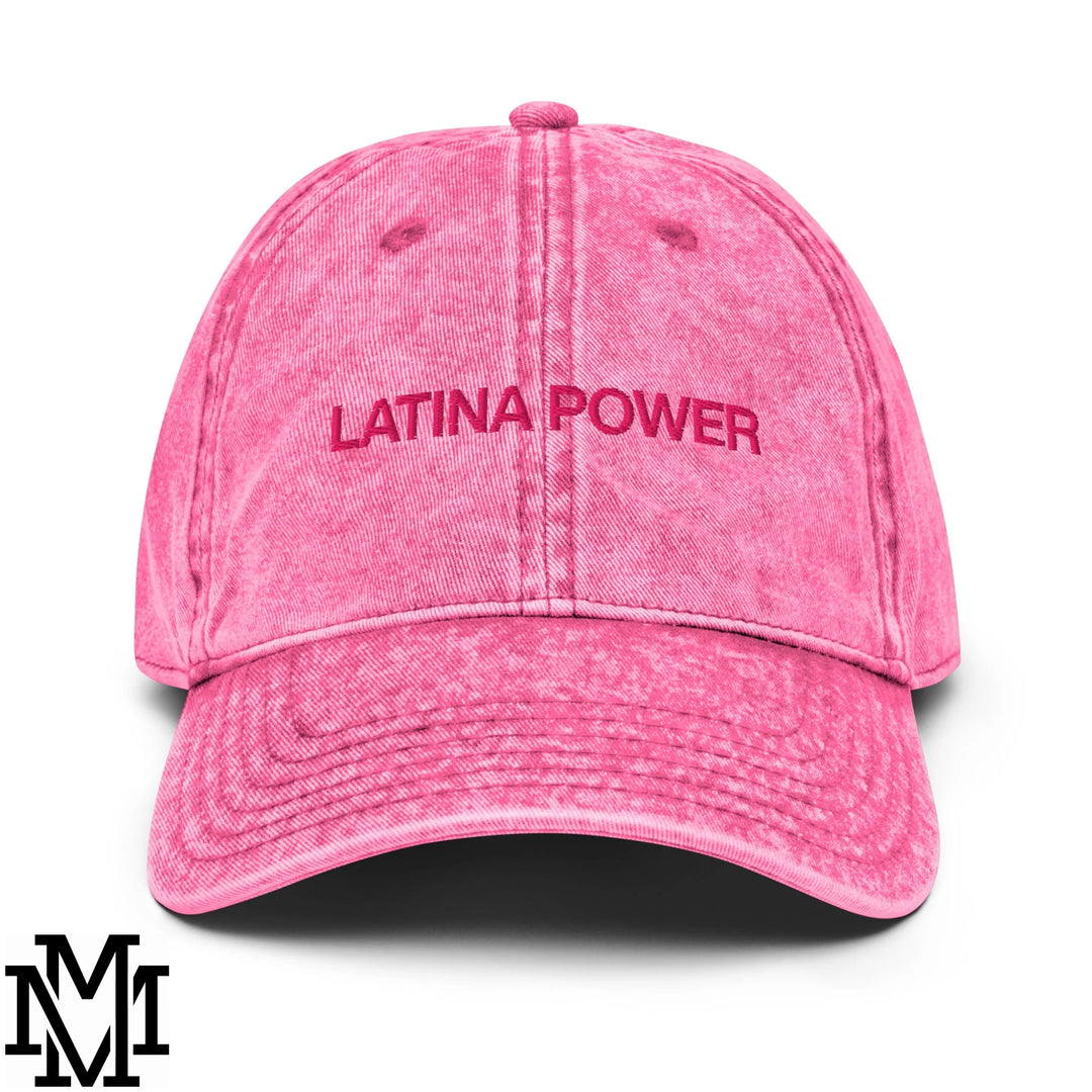 A faded pink denim dad hat with latina power embroidered in matching pink thread on the front