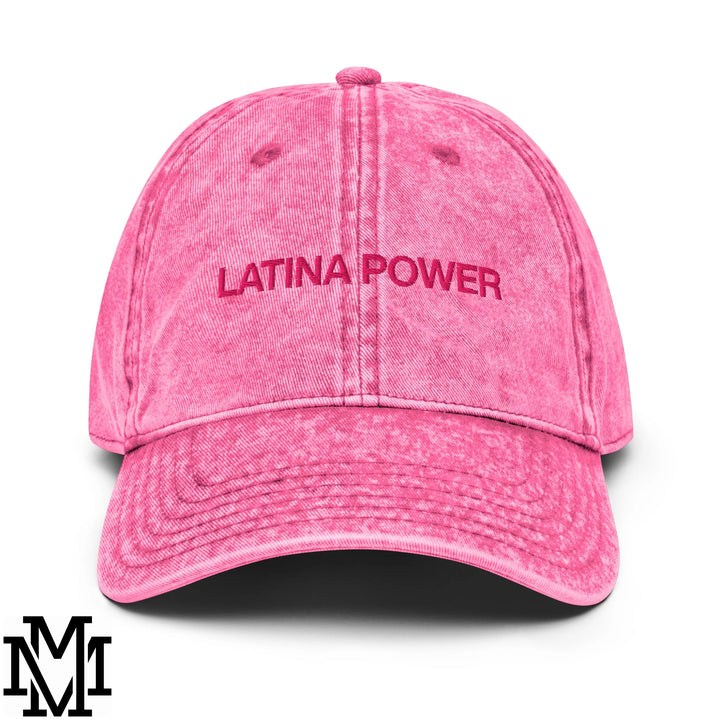 A faded pink denim dad hat with latina power embroidered in matching pink thread on the front
