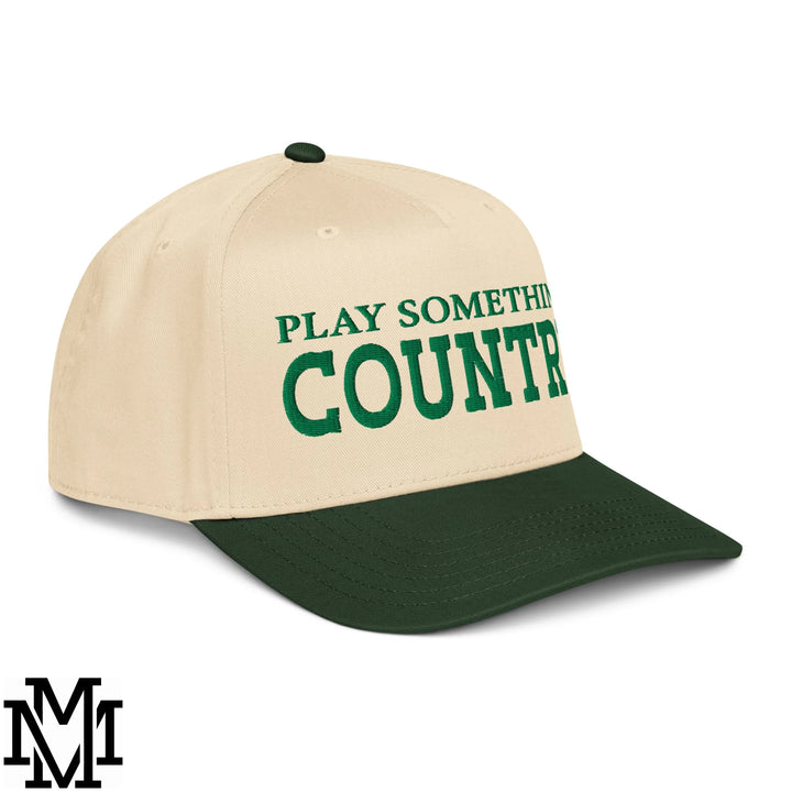 Beige and dark green baseball snapback hat with play something country embroidered in bold green lettering