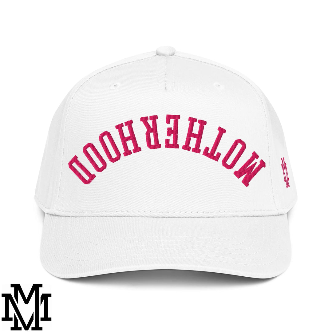 White baseball snapback hat with arched pink motherhood embroidery and small side logo in cotton material